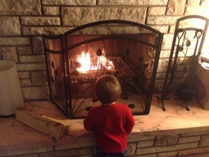 My son mesmorized by our fireplace